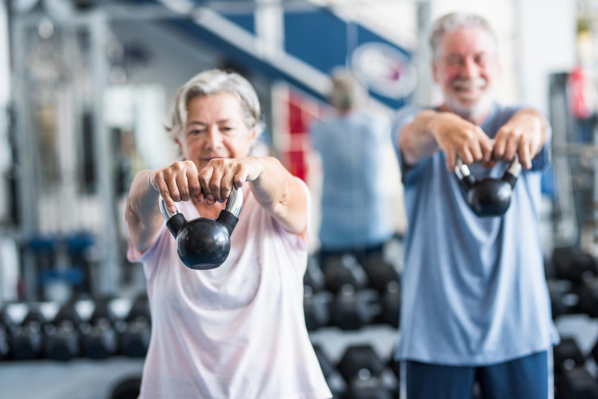 Elderly People Exercising with Kettlebells